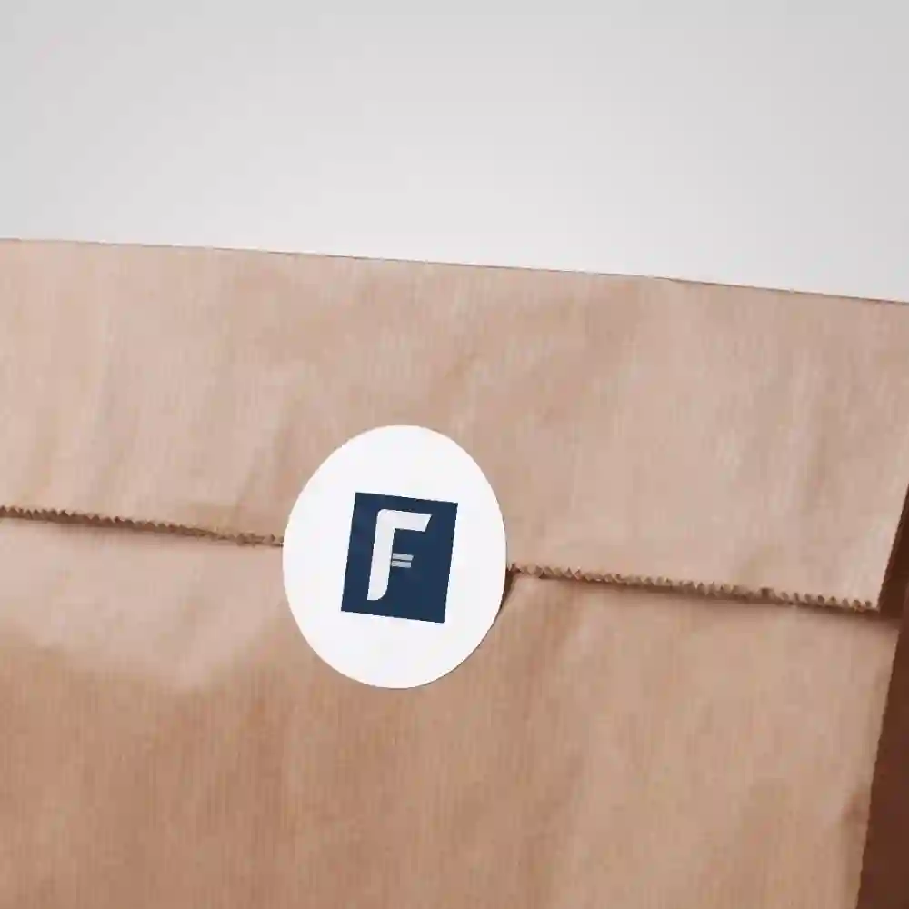 Flekstek logo sticker on a brown shipping envelope for stylish product packaging.